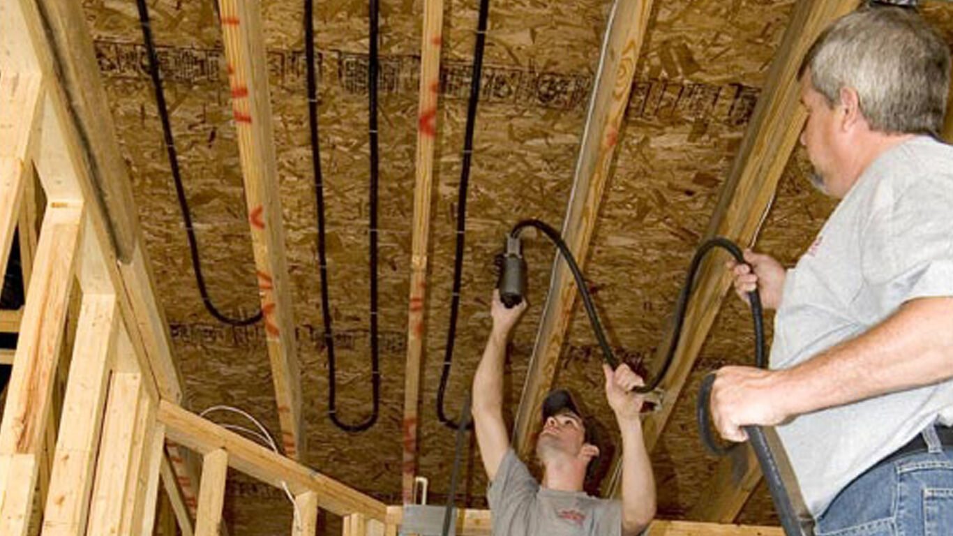 two men installing floor heating